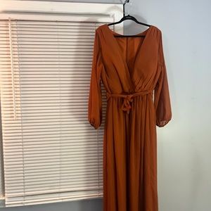Women’s size 22 burnt orange chiffon bridesmaid dress. Never been worn.